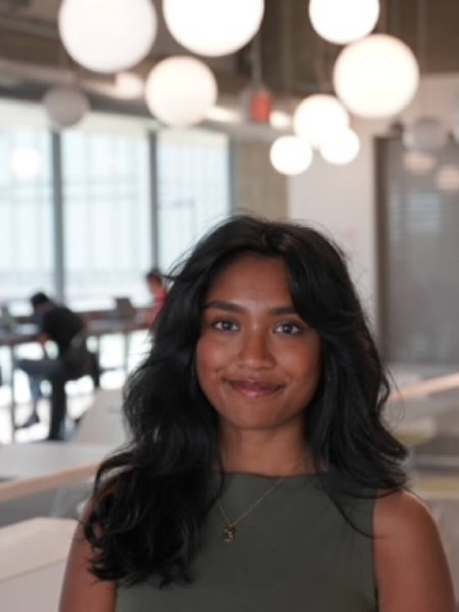 Aditi's photo is a headshot of her smiling and wearing a gray top or dress. 
