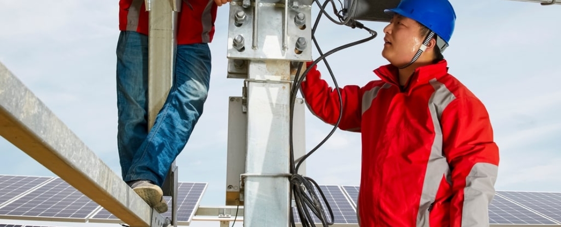people working on solar