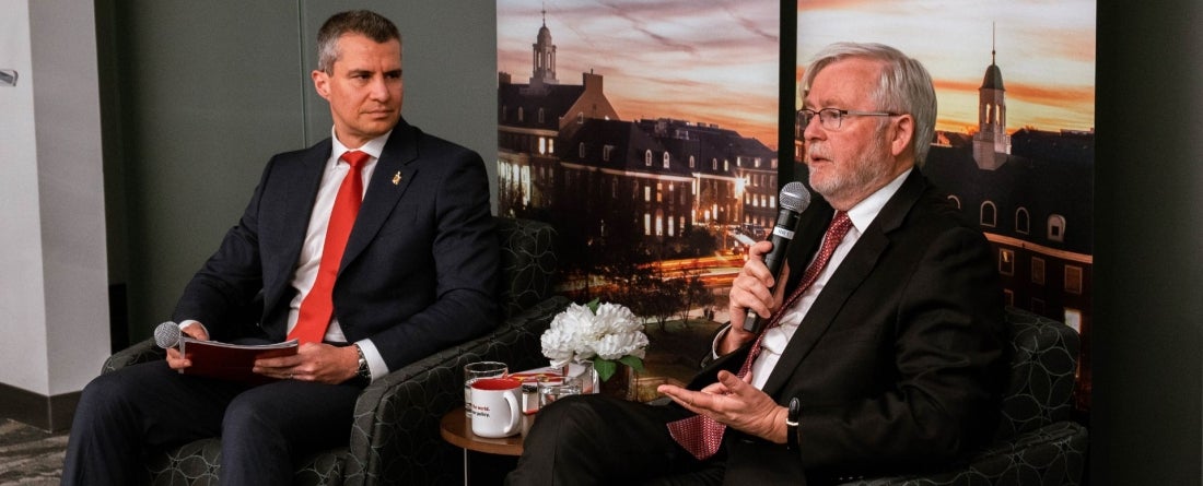 Dean Gustavo Flores-Macias and Ambassador Rudd sit and talk
