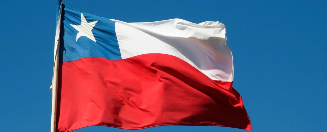 image of Chile flag against clear blue sky